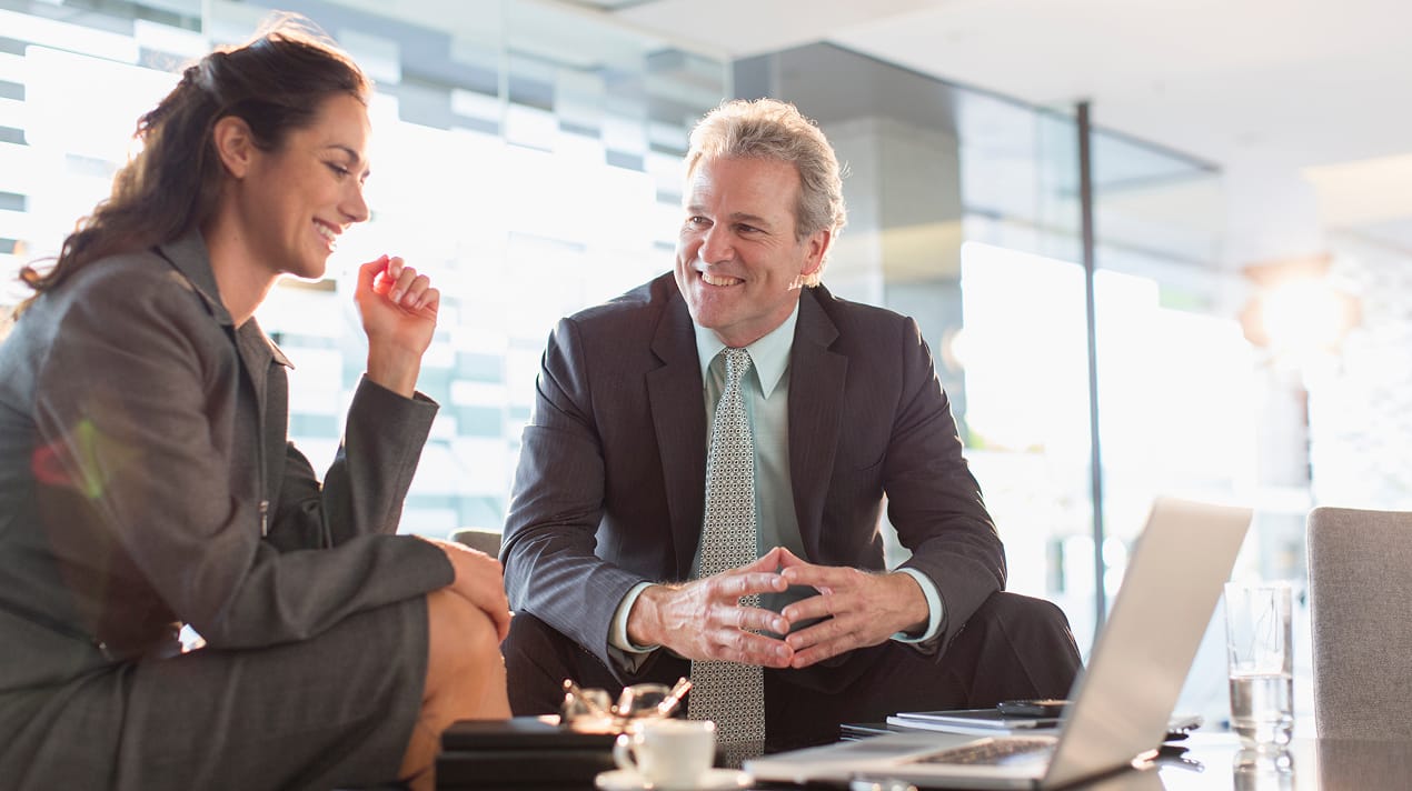 two persons discussing